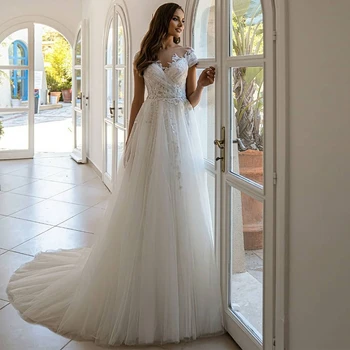 Seksi A-Line düğün elbisesi O-Boyun Aplikler Boncuk ve Kapmak Pleats Kapalı Beyaz Tül Marring Abiye Uzun Illusion gelin elbiseleri